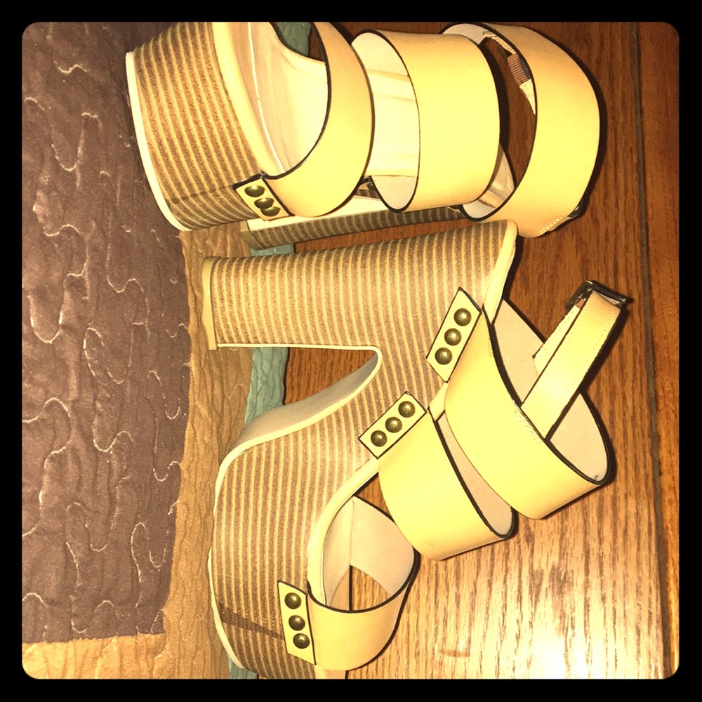 Never worn JUST FAB platforms.